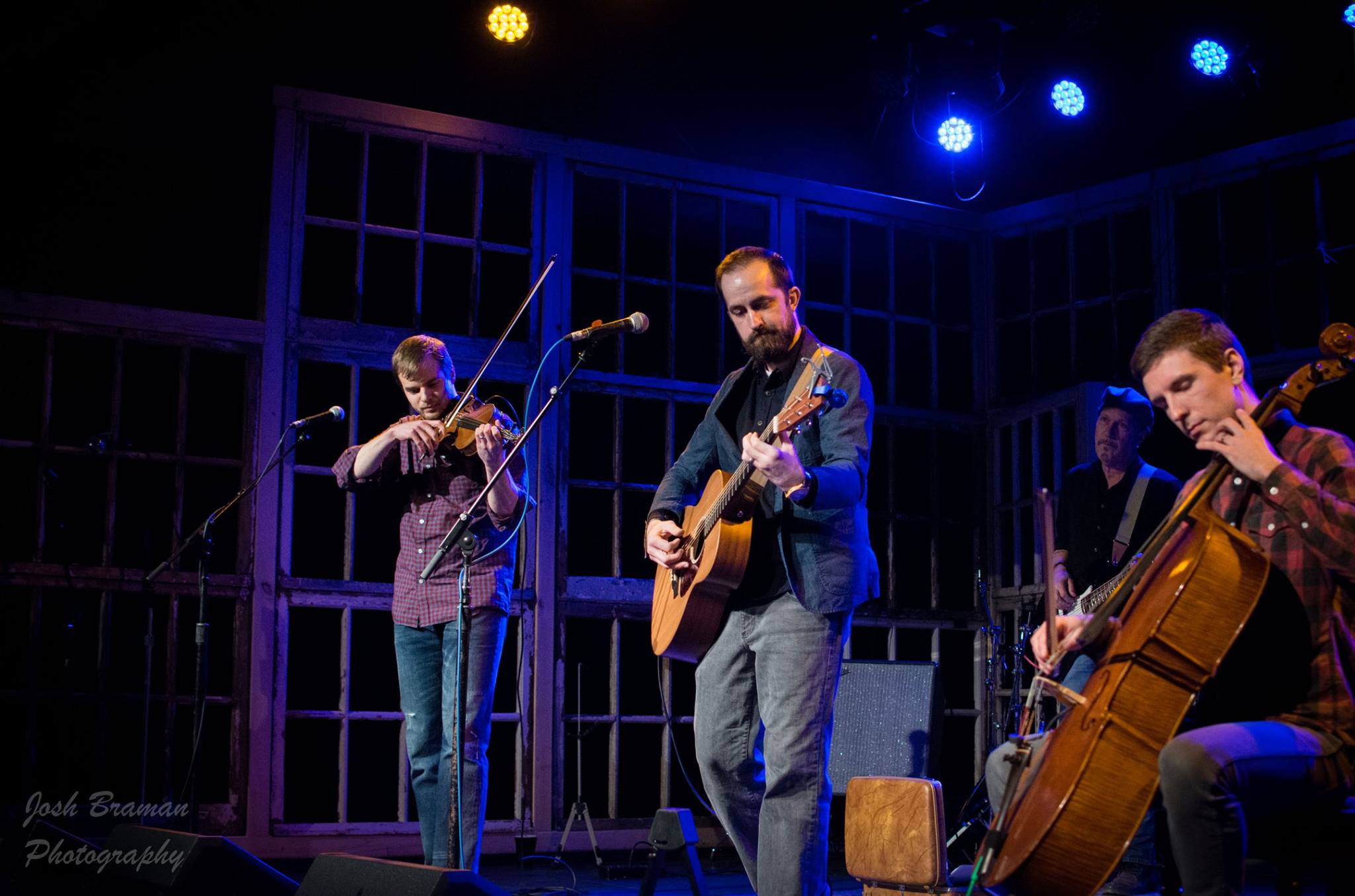 A group of people playing instruments

AI-generated content may be incorrect.